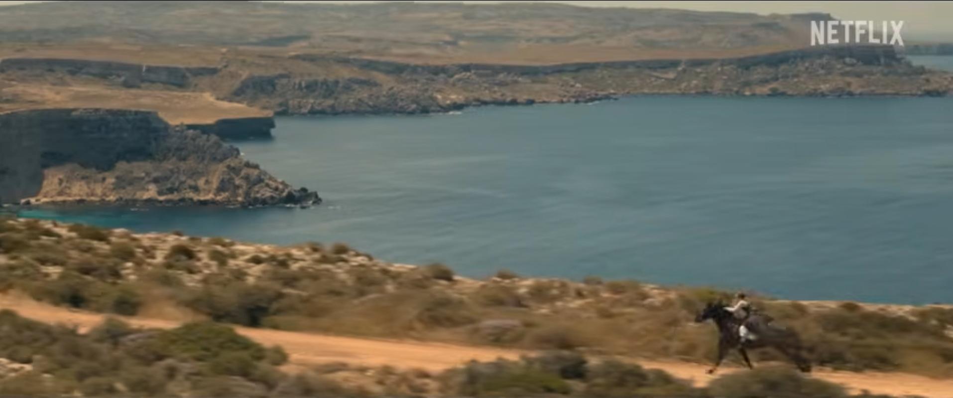 Brown said in a recent interview she did the stunts herself. Here she is seen against a Malta cliffs backdrop. Screenshot: Netflix/Enola Holmes 3
