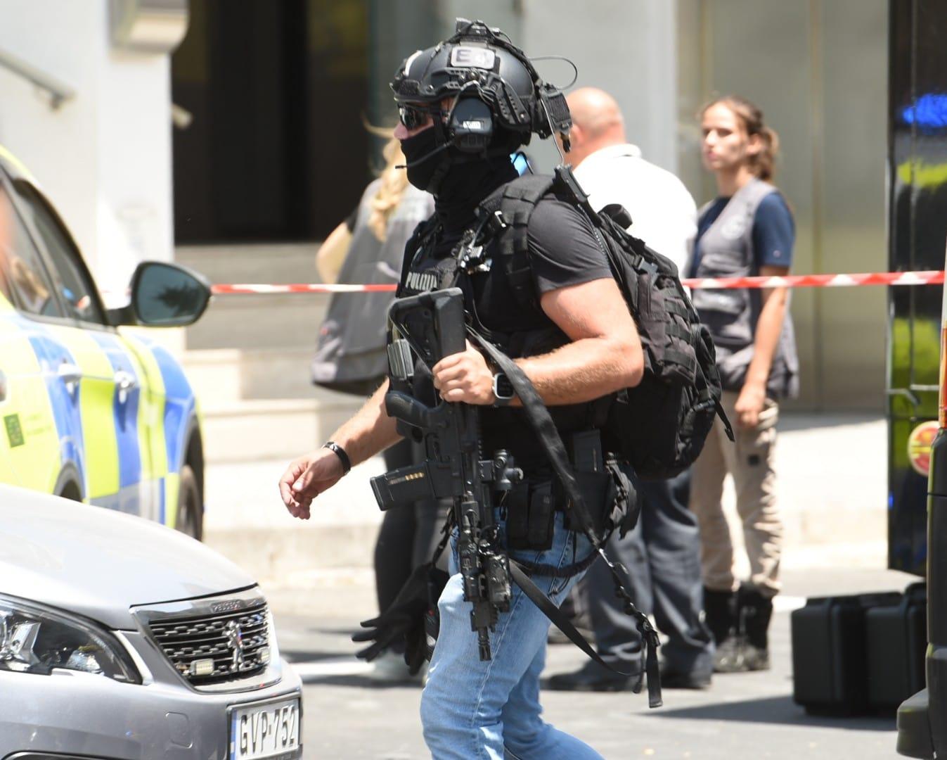 An armed officer at the scene of the incident. Photo: Chris Sant Fournier
