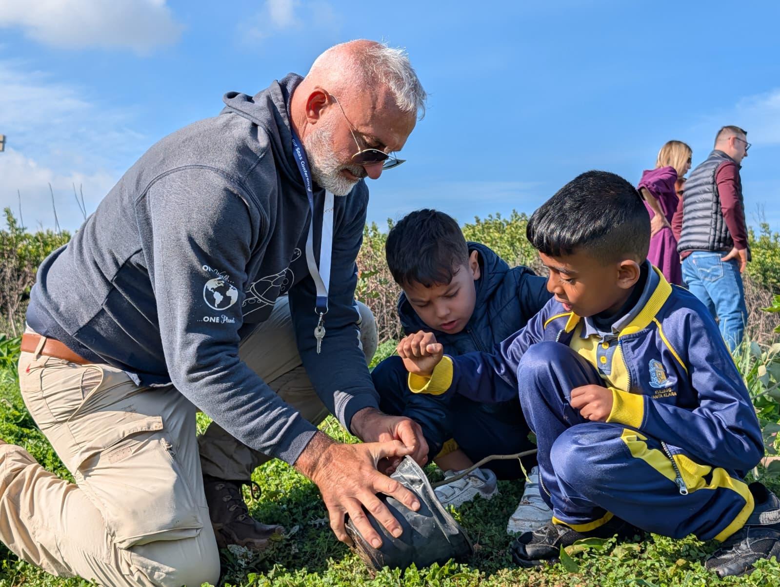 Year Four schoolchildren learn how to plant the trees. Photo: Chris Sant Fournier