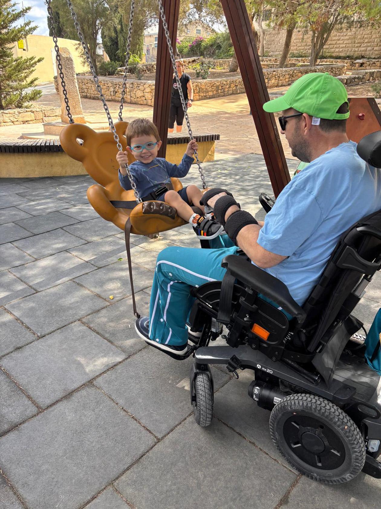 Brandon can push his son Alex on the swing but can&rsquo;t help him on the slide. Photos: Bonavia Family