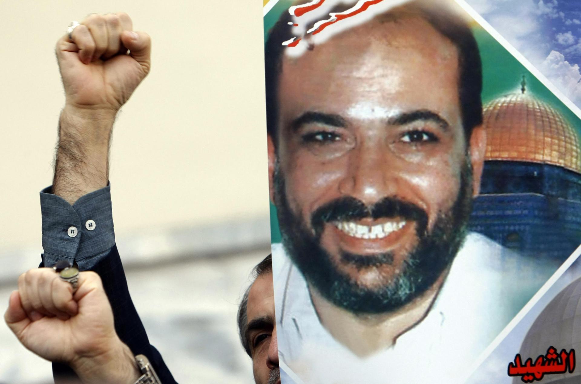 An Iranian demonstrator chanting anti-Israeli slogans and holding a protrait of Fathi Shaqaqi in Tehran&rsquo;s Palestine square in 2008. Photo: AFP