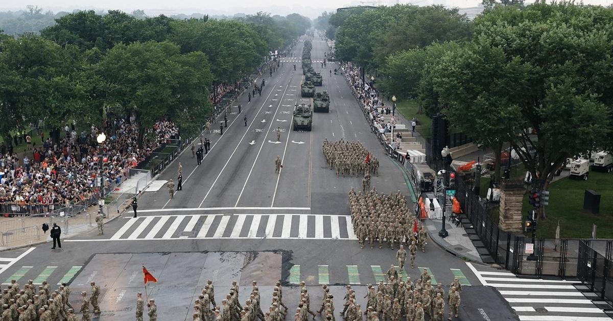 Trump flexes military might at parade as protests sweep the US