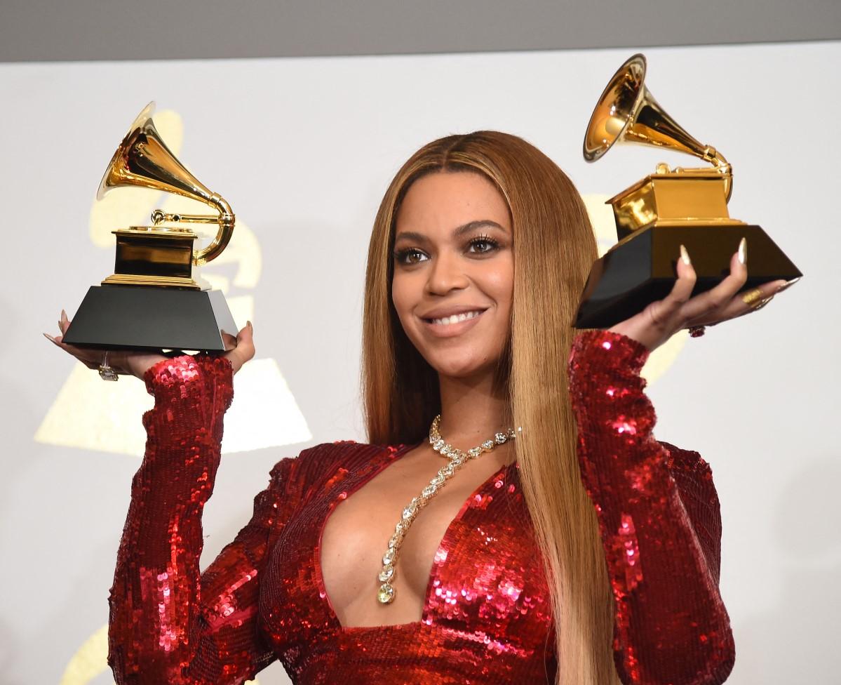 Beyonce poses with her Grammy trophies in the press room during the 59th Annual Grammy music Awards on February 12, 2017, in Los Angeles, California. Photo: Robyn Beck/AFP