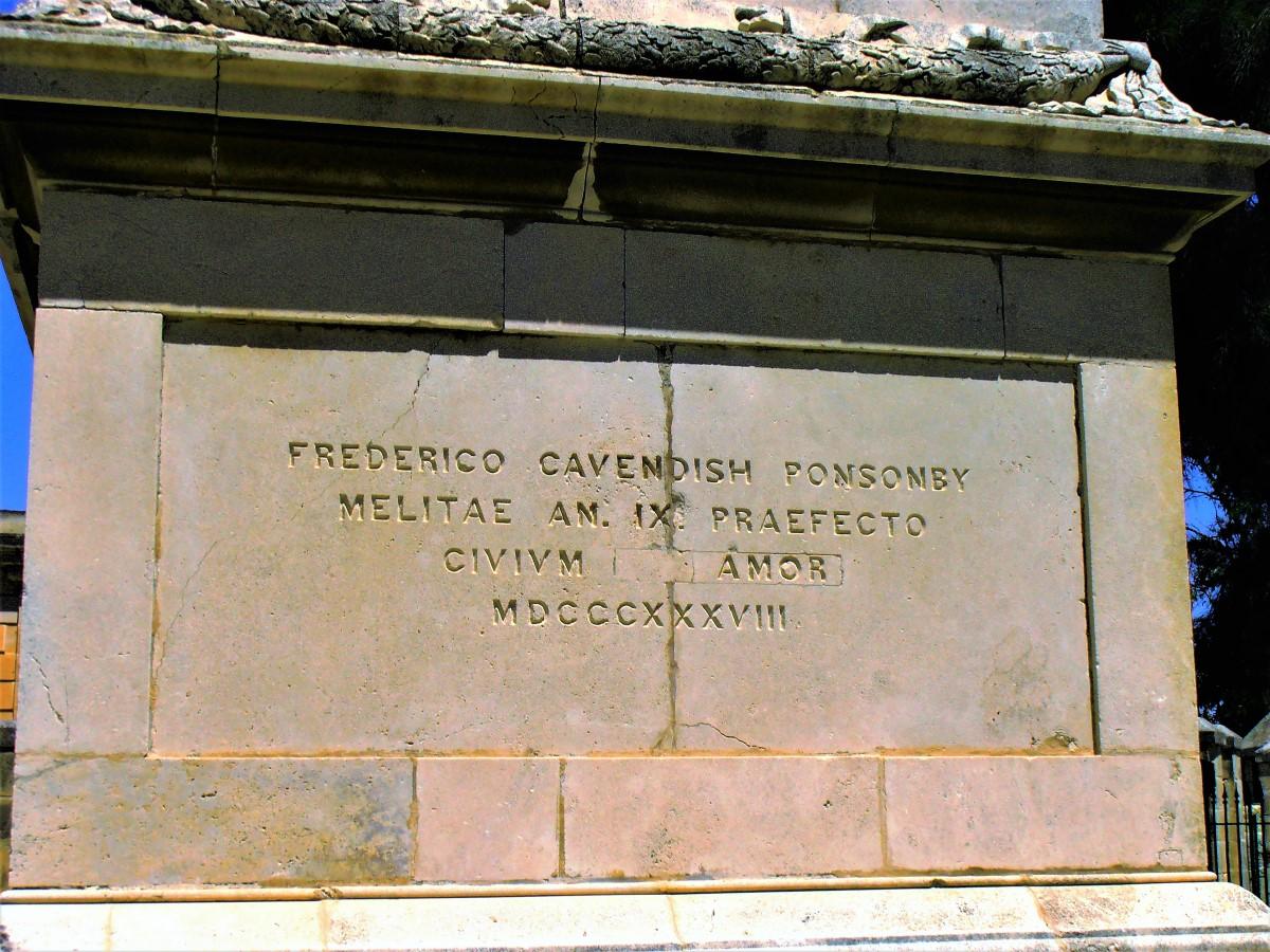 A close-up showing the inscription on the base of the column.