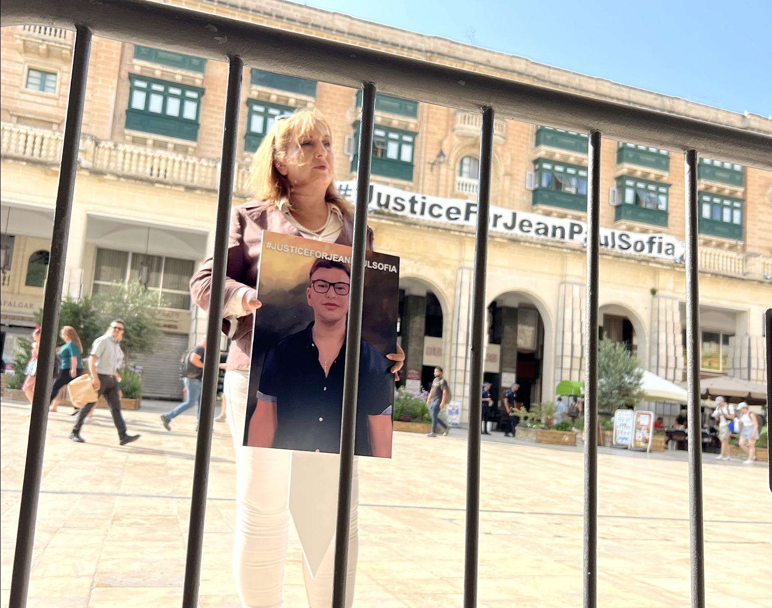 Isabelle Bonnici with a photograph of her son Jean Paul Sofia, says she is saddened by the reappointment of Kurt Buhagiar to his government job. Photo: Chris Sant Fournier