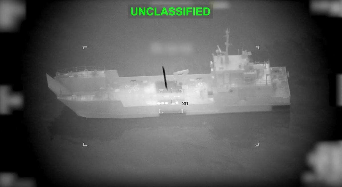 This screen grab obtained from video released by the US Central Command shows what they say is an Iranian naval vessel as it is struck by a projectile "near the Strait of Hormuz" as part of "Operation Epic Fury". Photo: AFP