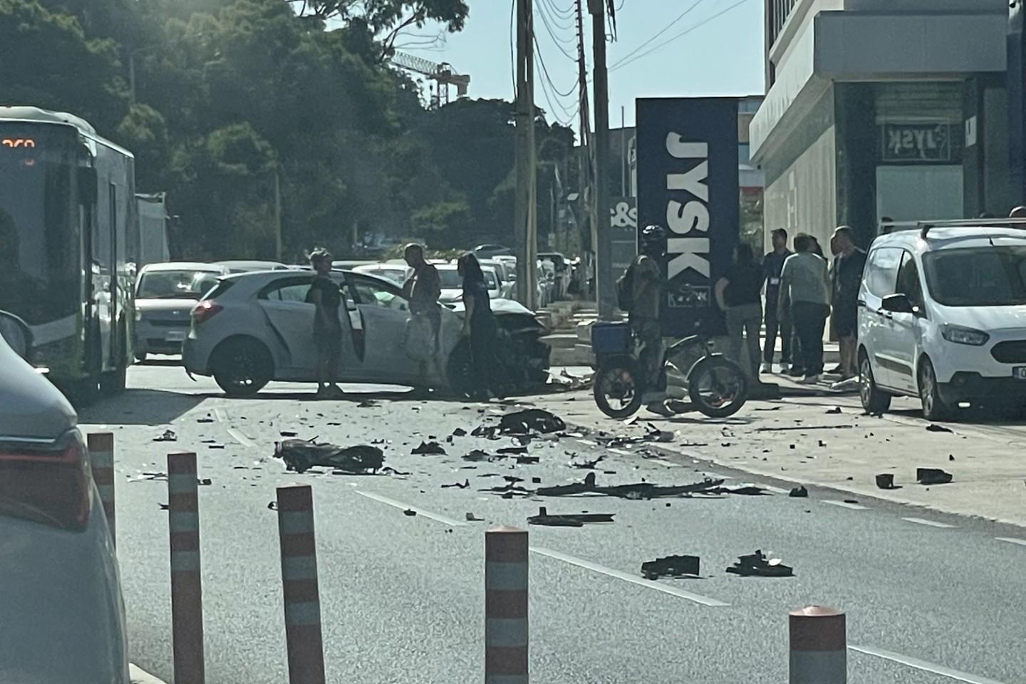 Car debris is scattered on Mosta Road, Lija.