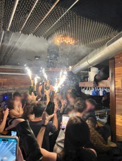 Partygoers were holding bottles with sparklers attached as the blaze began to spread.