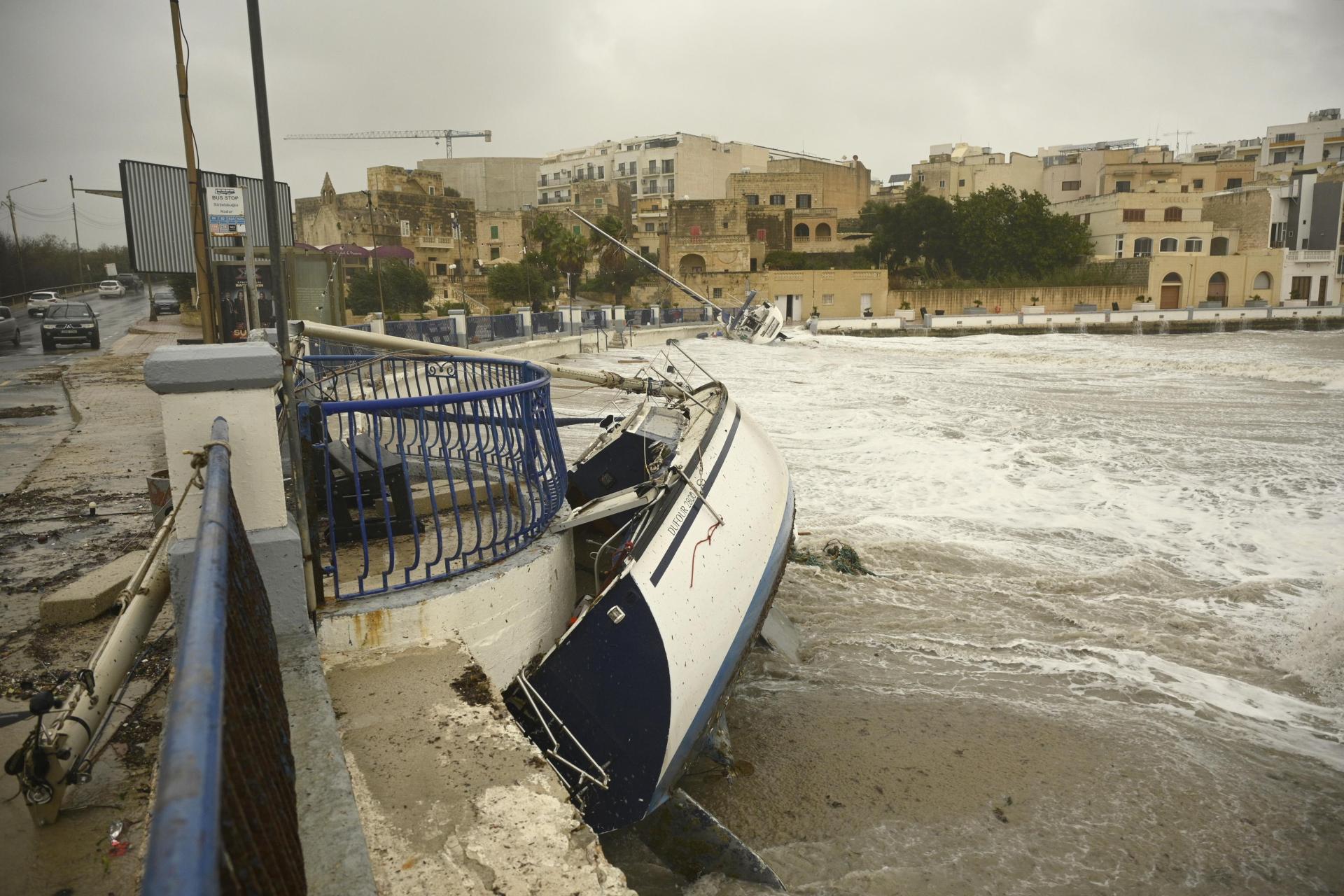 Strong waves carried boats up to the road in Birżebbuġa, dashing them on the promenade. Photo: Matthew Mirabelli.