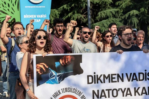 Turkey editor, NGO staff held on 'terror' charge ahead of NATO summit