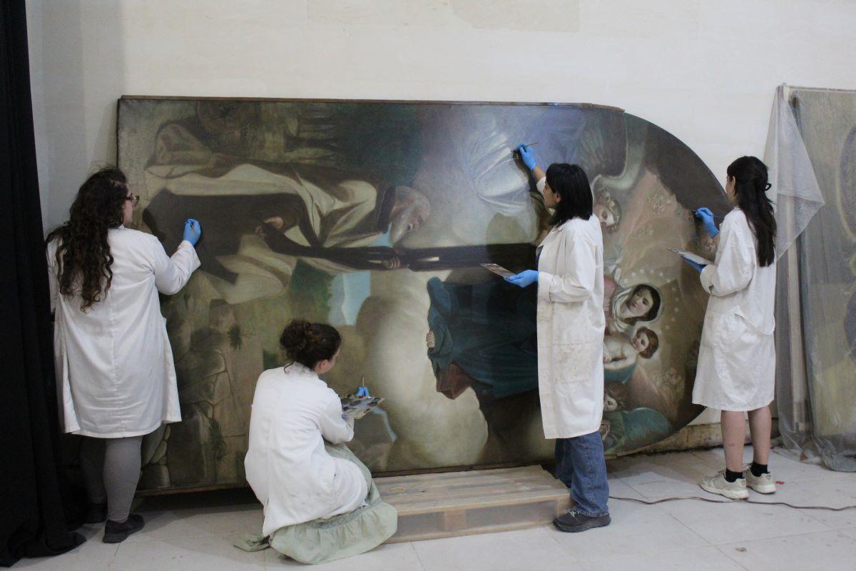 The conservators together with director Amy Sciberras, during the final phases of chromatic integration. Photo: ASC Conservation Centre Ltd