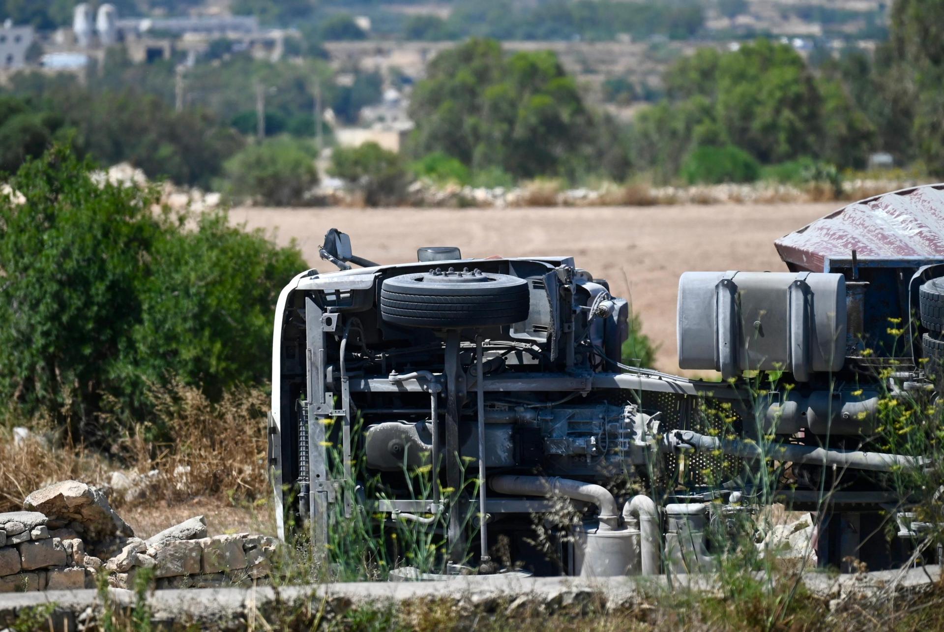 The three large vehicles ended up resting on their sides following the collision. Photo: Jonathan Borg