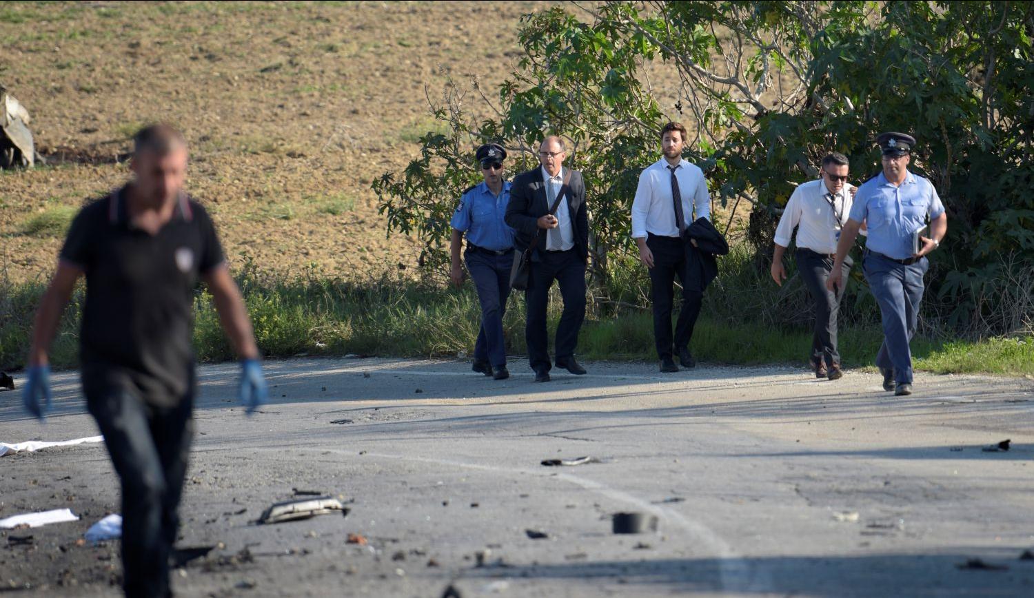 Peter Caruana Galizia (centre) and his son Andrew arriving on site together with police on that tragic October 17 afternoon. Photo: Mark Zammit Cordina