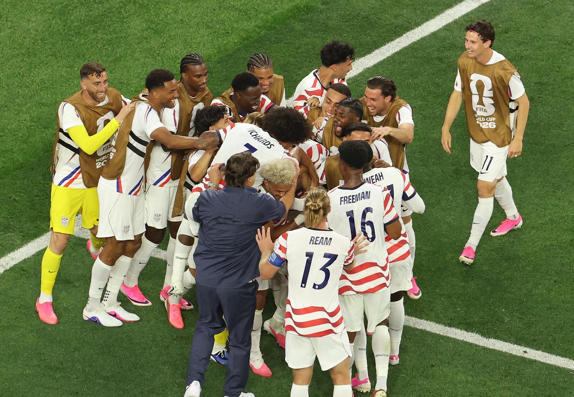 American players celebrate after scoring against Paraguay on Saturday. Photo: AFP