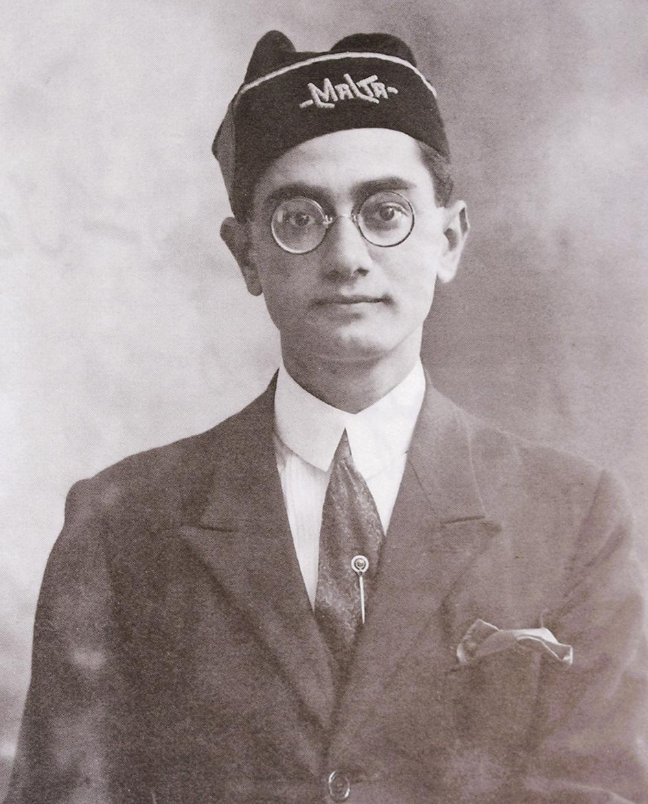 An undergraduate in 1923, wearing the distinctive Malta University cap.