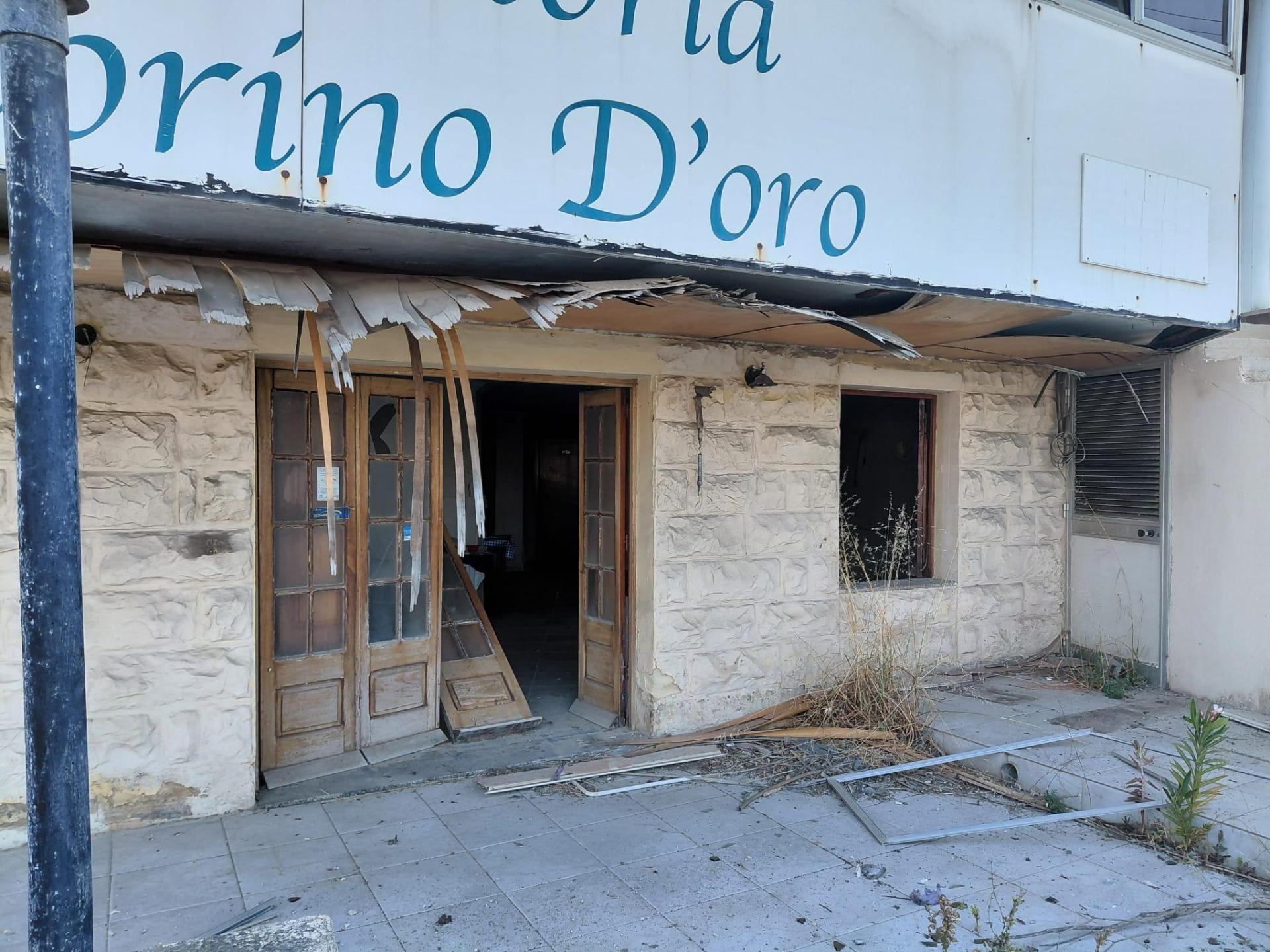 The facade of a nearby business saw extensive damage.