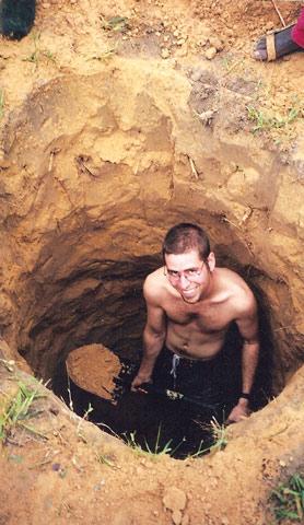 Primitive conditions: the author&rsquo;s husband digging out the toilet pit.