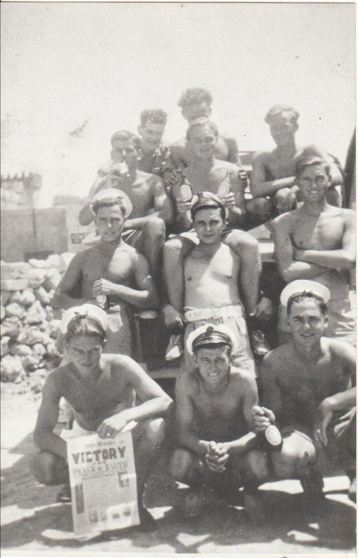 Naval ratings showing the front page of the Times of Malta issue of August 15, 1945, and celebrating with beer the surrender of Japan. Photo: National War Museum Archives