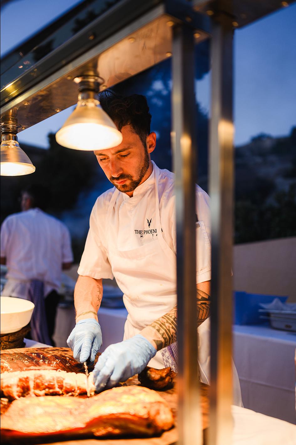A chef preparing a cut of meat. Photo: Albert Camilleri