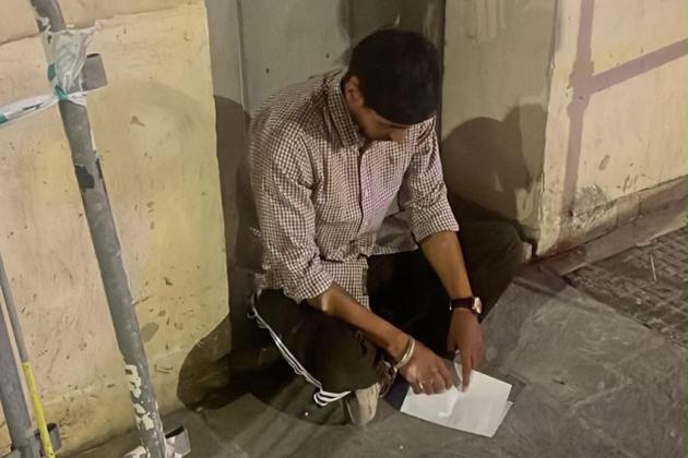 Food courier says he was beaten at pizzeria and treated badly by police
