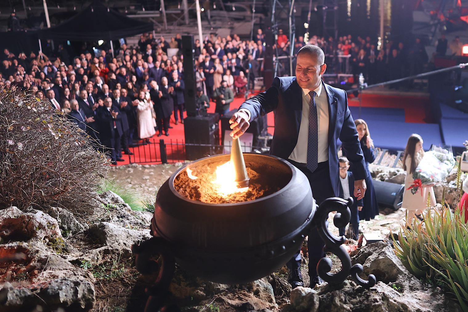 Abela lighting the ceremonial brazier. Photo: DOI.