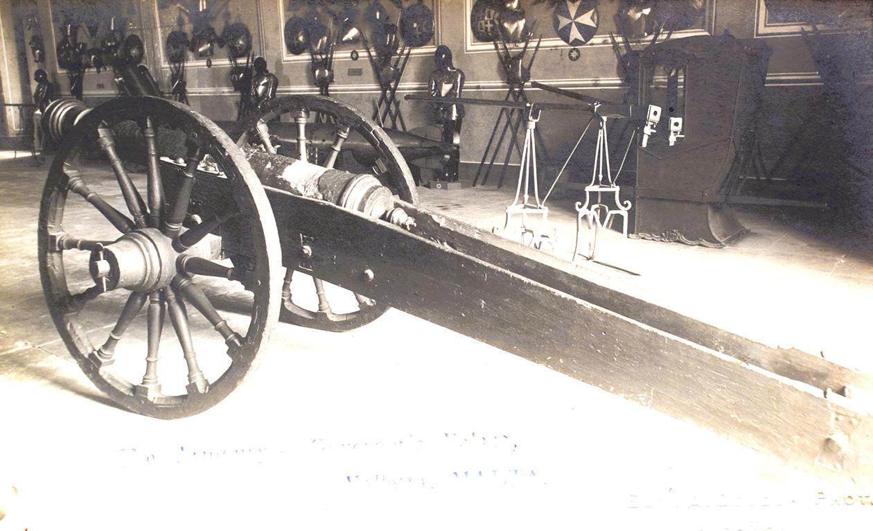 An Edward Alfred Gouder 1920s postcard of a cannon at the Palace armoury