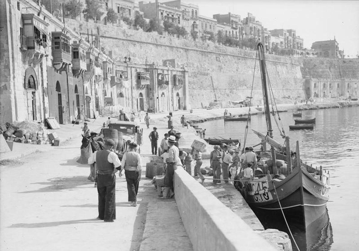 Unloading supplies off Gozo boats at the Valletta waterfront. Photo: Imperial War Museums