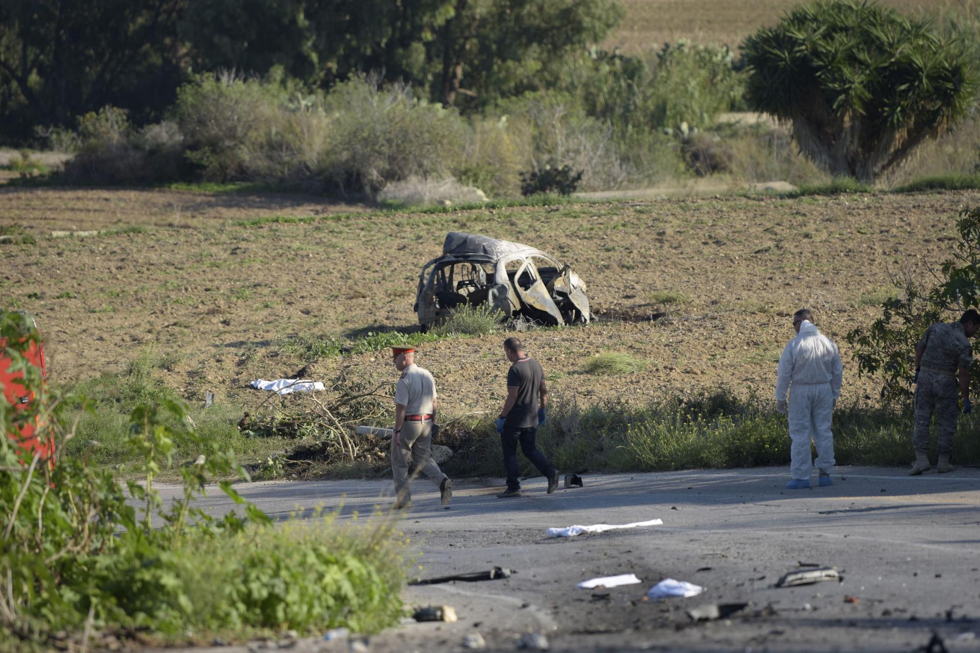 Daphne Caruana Galizia's burnt out car in the aftermath of the bomb explosion that killed her. Photo: Mark Zammit Cordina