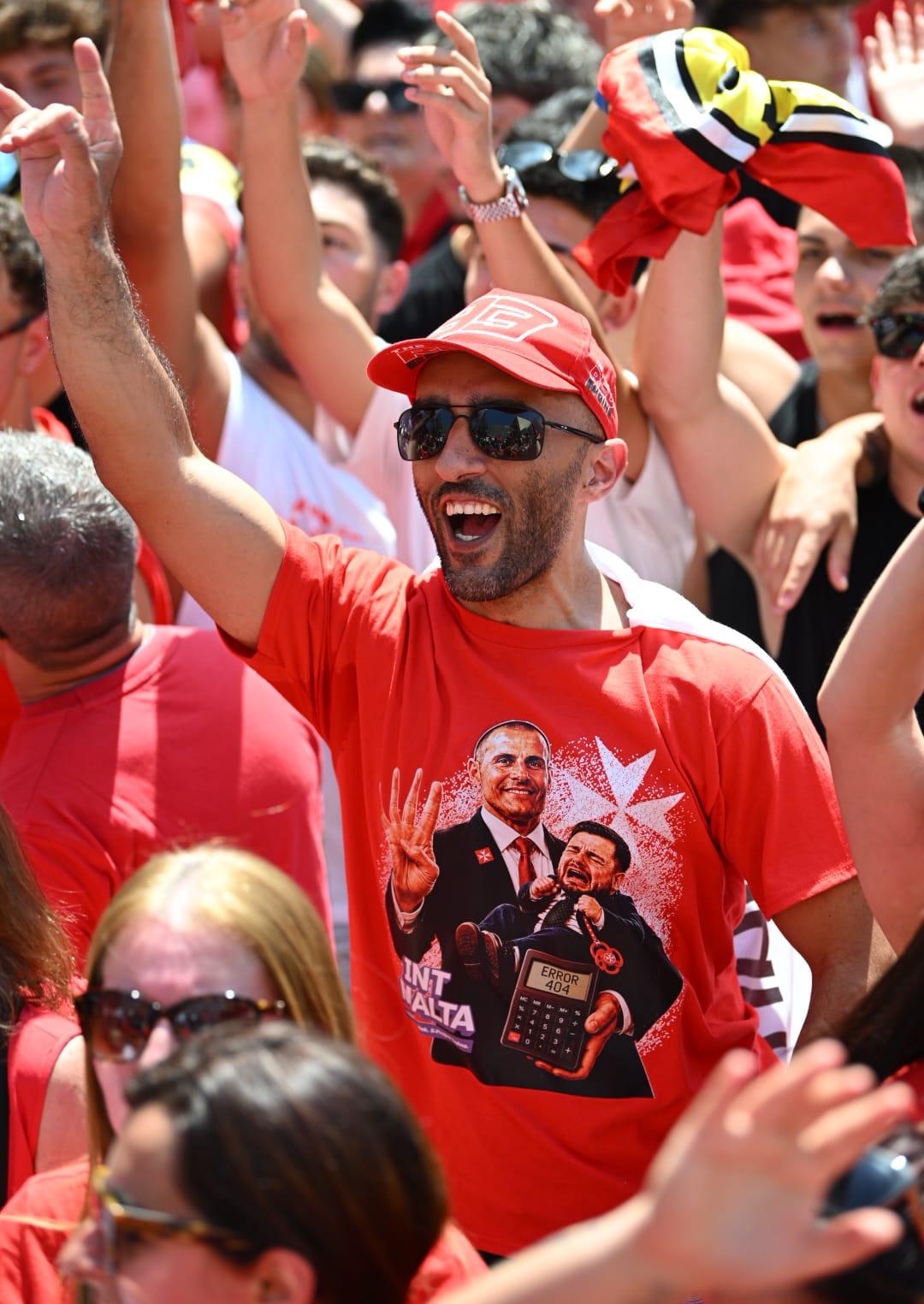 A Labour supporter celebrating the party's fourth win. Photo: Matthew Mirabelli