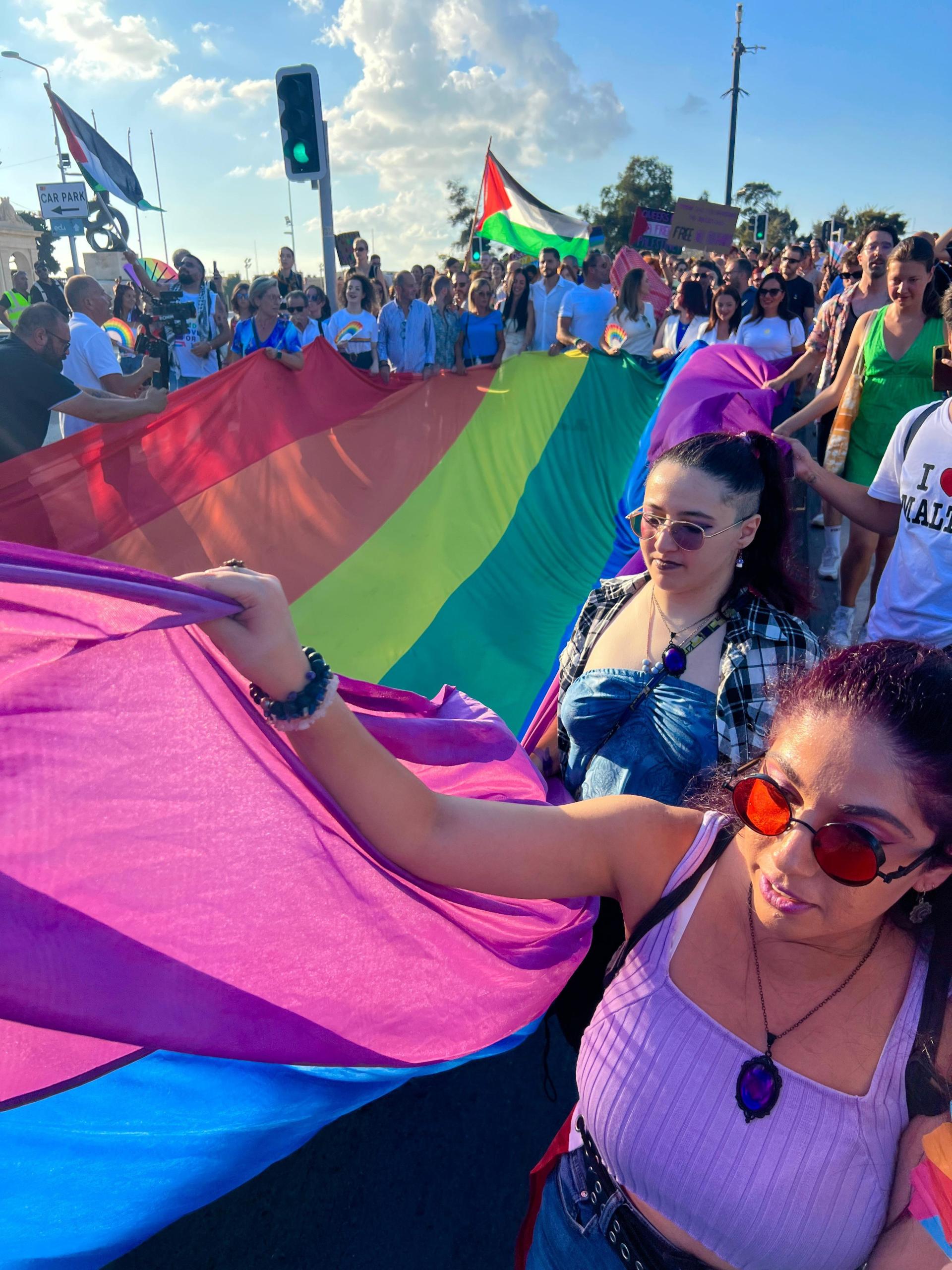 Prime Minister Robert Abela and PN leader Alex Borg helped carry a giant rainbow flag through Valletta. Photo: Chris Sant Fournier