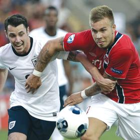 England&rsquo;s Adam Smith (left) and Norway&rsquo;s Marcus Pedersen fight for the ball during their Euro U-21 Championship Group A match on Saturday.