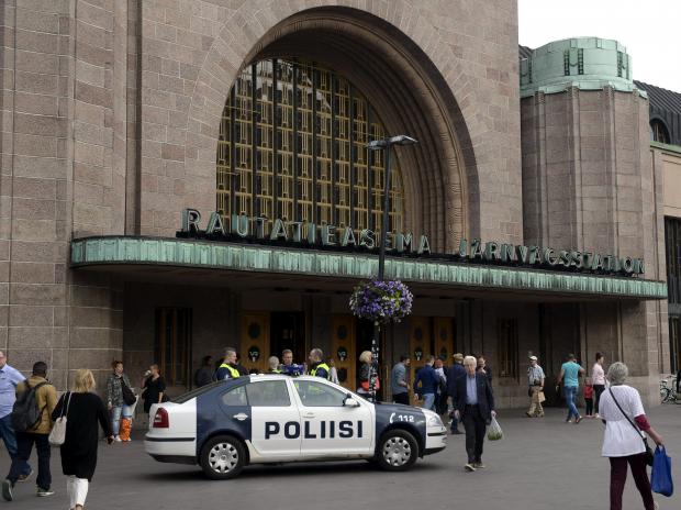 Finnish police patrol in front of Turku's central railway station. Photo: Reuters
