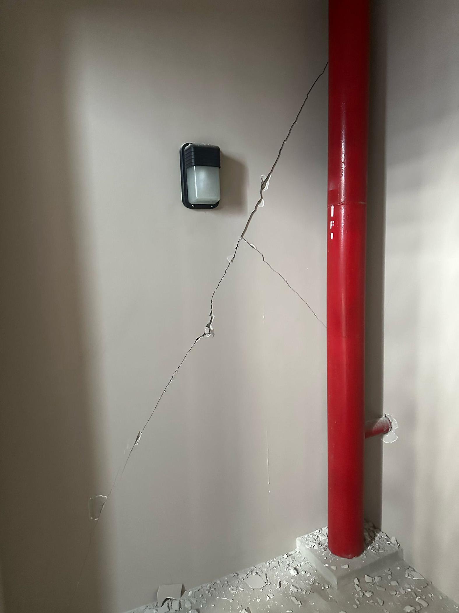 Large cracks left in the walls of the building.