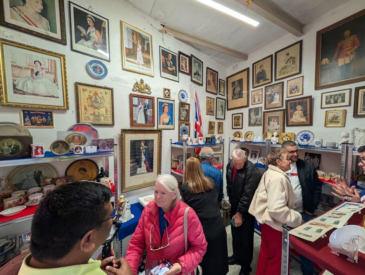 Visitors squeeze into the 15-square-metre miniature museum.