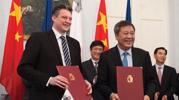 Kornad Mizzi presiding over the signing of a &euro;320 million equity deal with Shanghai Electric in 2014.