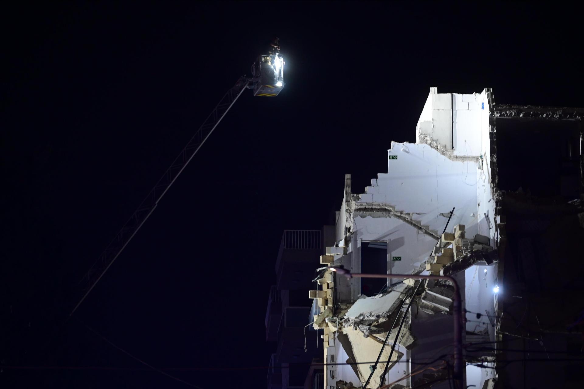 Rescue workers analyse the site using a crane. Photo: Jonathan Borg