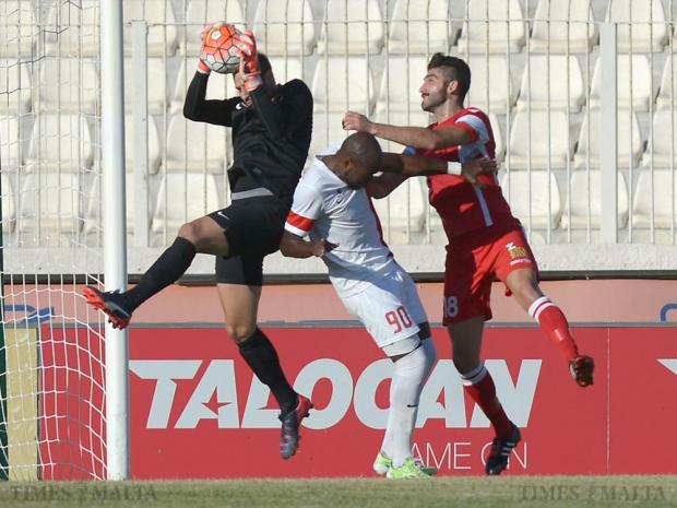 Valletta&rsquo;s Romeu Romao (centre) tries to block Naxxar&rsquo;s Ishmael Grech as Valletta goalkeeper Henry Bonello (left) makes a save at the National Stadium in Ta&rsquo;Qali on September 27. Photo: Matthew Mirabelli