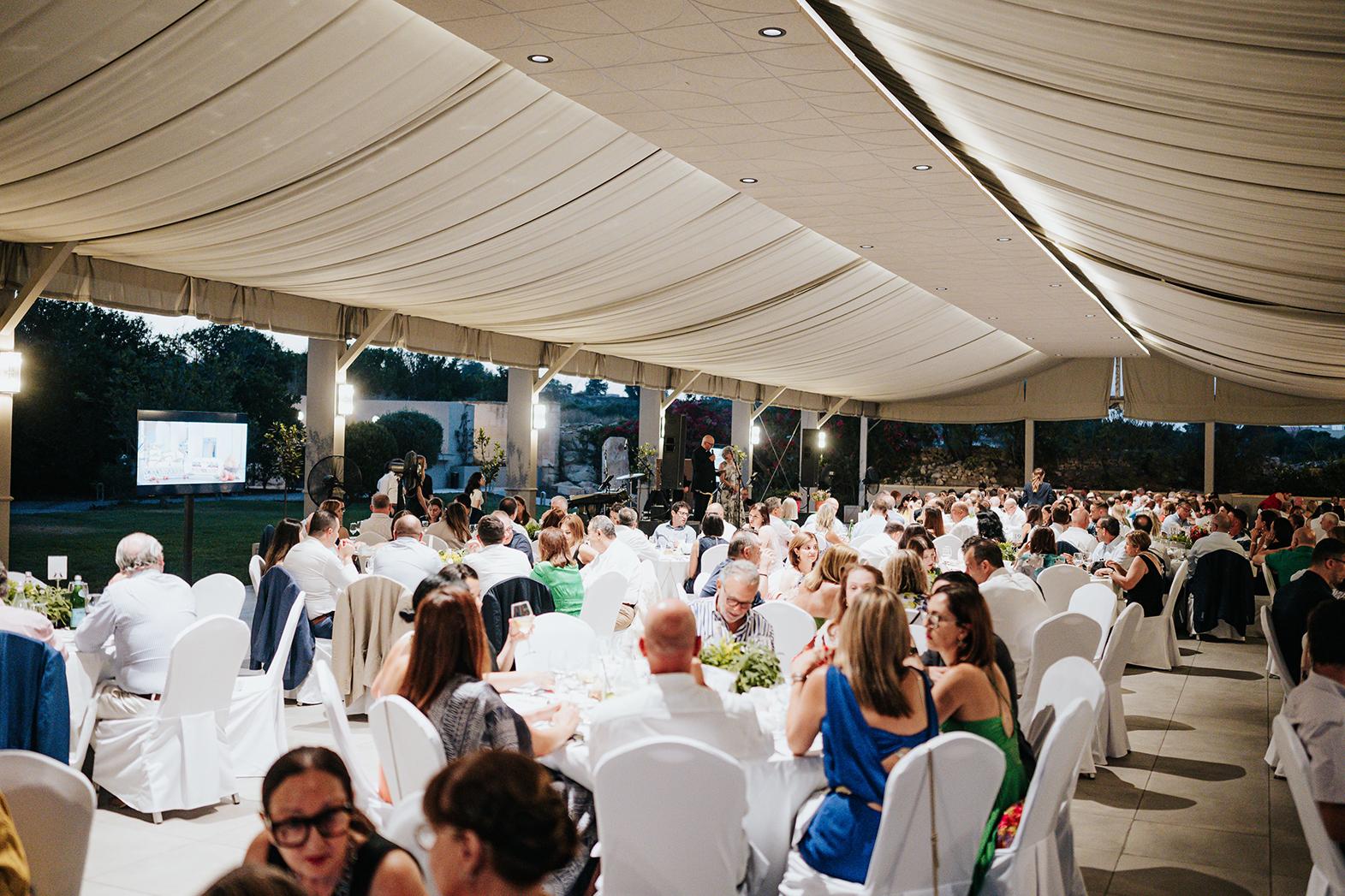 Guests enjoying the charity dinner.
