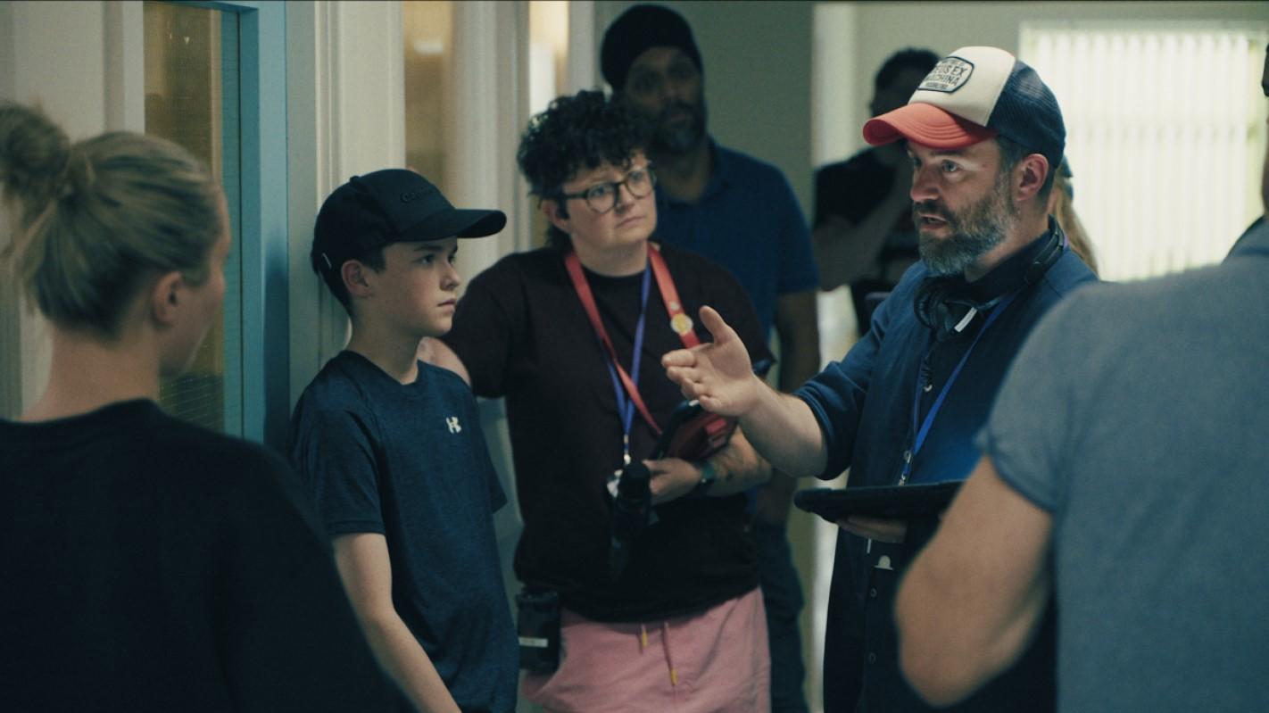 Owen Cooper with the director and other crew members during filming..
