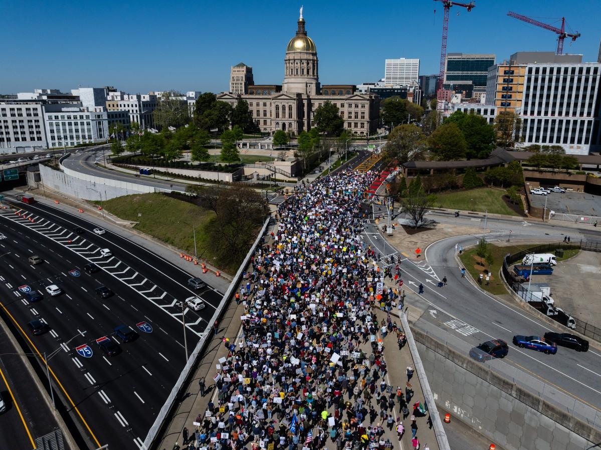 An aerial view shows people marching near the Georgia state Capitol building during the "No Kings" national day of protest in Atlanta, Georgia. Photo: AFP