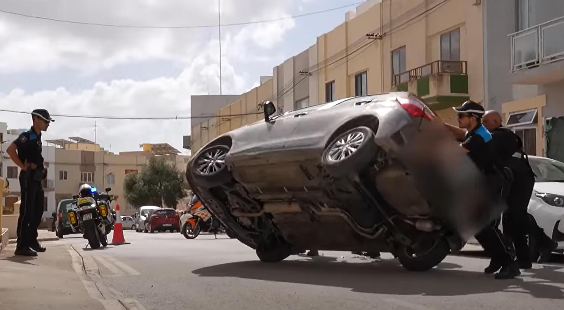 A Transport Malta controller takes a call: a car has just overturned in Luqa.