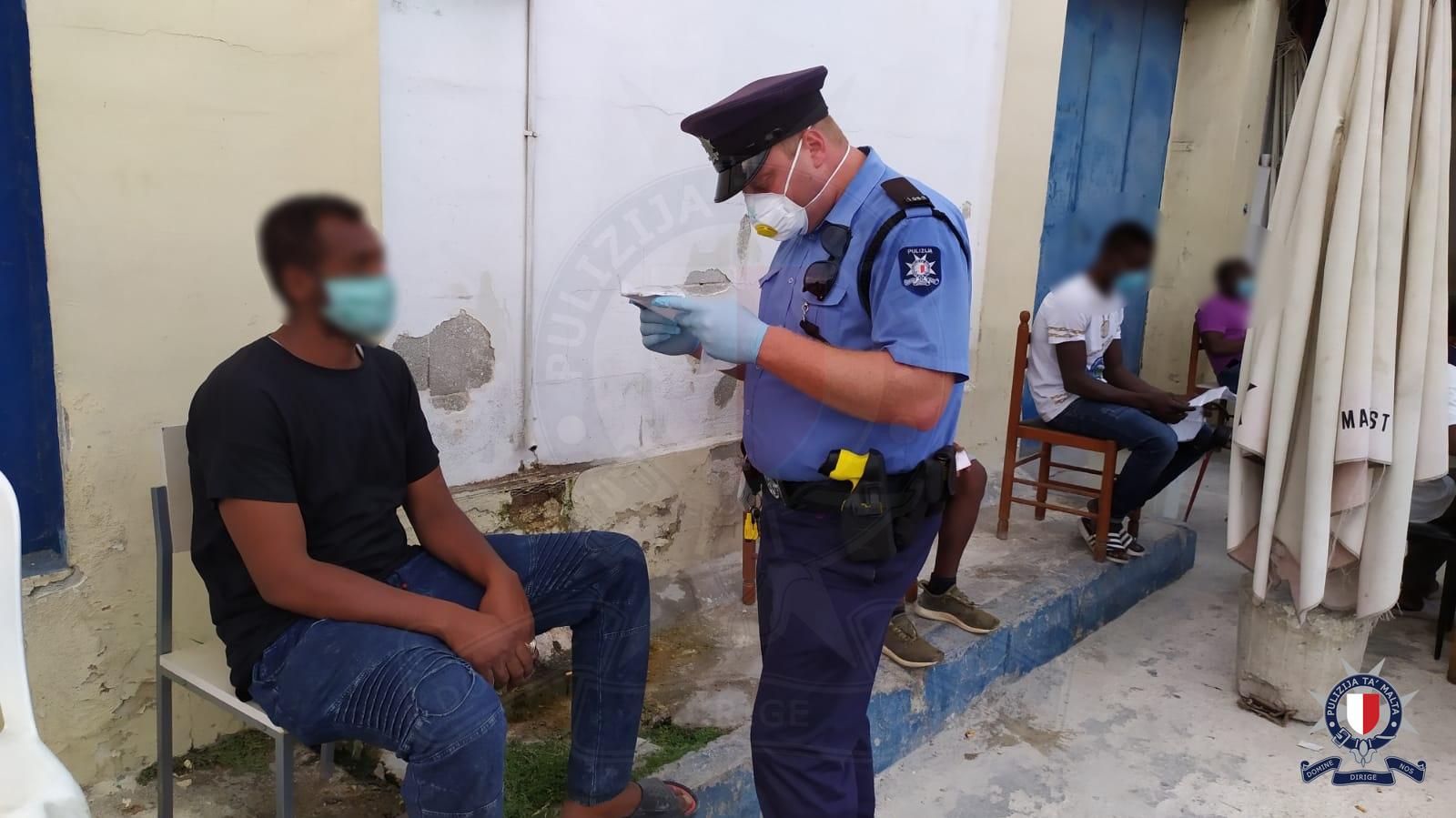Immigration police check patron's documents. Photo: Police CMRU