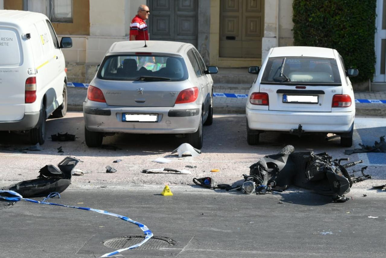 The courier's motorcycle was split in two by the crash. Photos by Matthew Mirabelli.