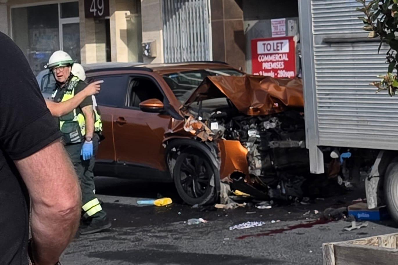 The car crashed heavily into the delivery van.