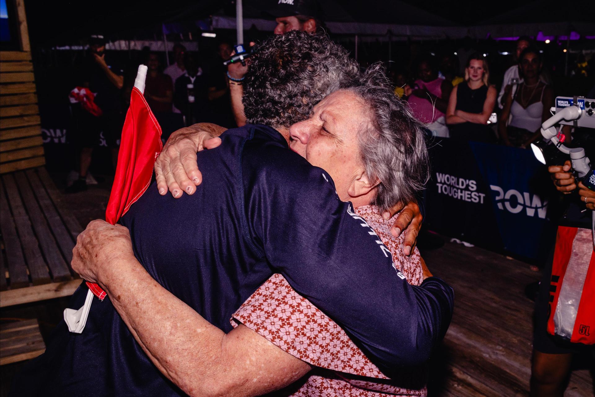 Steve Chetcuti hugging his mother upon his arrival in Antigua. Photo: World's Toughest Row