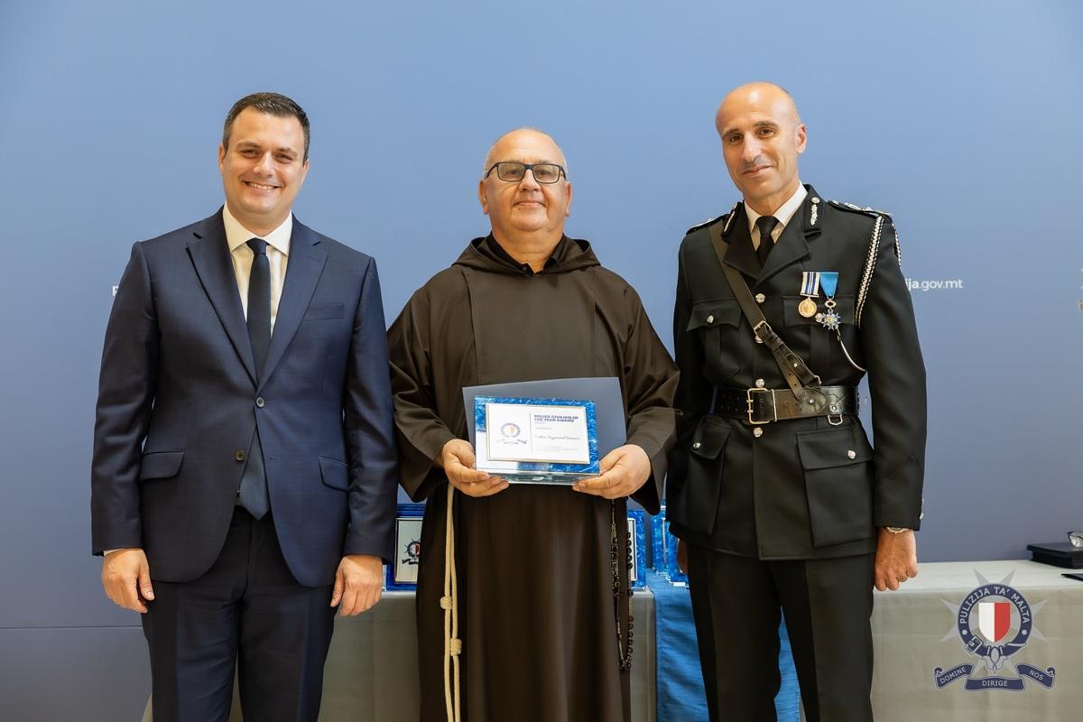 Fr Raymond Bonnici was recognised for his 25 years of service to the police force. Photo: Malta Police