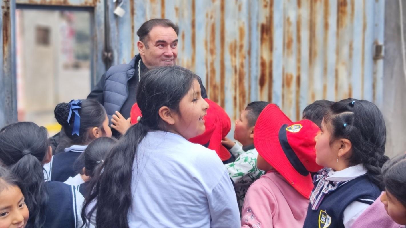 Mgr Giovanni Cefai, MSSP, with children on their first day at the new school in Huancan&eacute;.