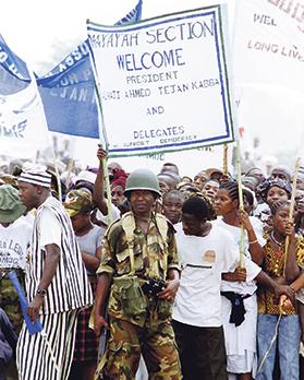 Sierre Leone citizens await the triumphant return of President Ahmad Tejan Kabbah in Freetown, on March 10, 1998. Nigerian-led West African troops had launched a military offensive the month before to oust rebel leaders who had deposed the president in May 1997. Photo: Reuters