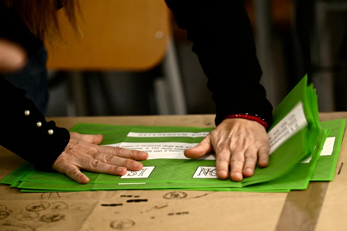 A person prepares the counting of the ballot boxes during the referendum. Photo: AFP