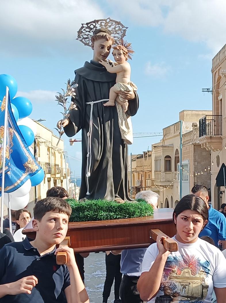 Children carrying the statue of St Anthony during the procession.